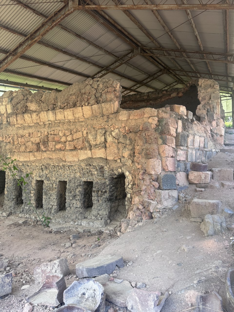 An old Bizen climbing kiln (noborigama) of brick and stone under a shelter in Imbe