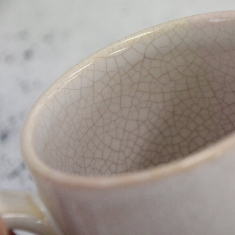 Close view of a pale Hagi glaze covered in a fine web of crackle lines