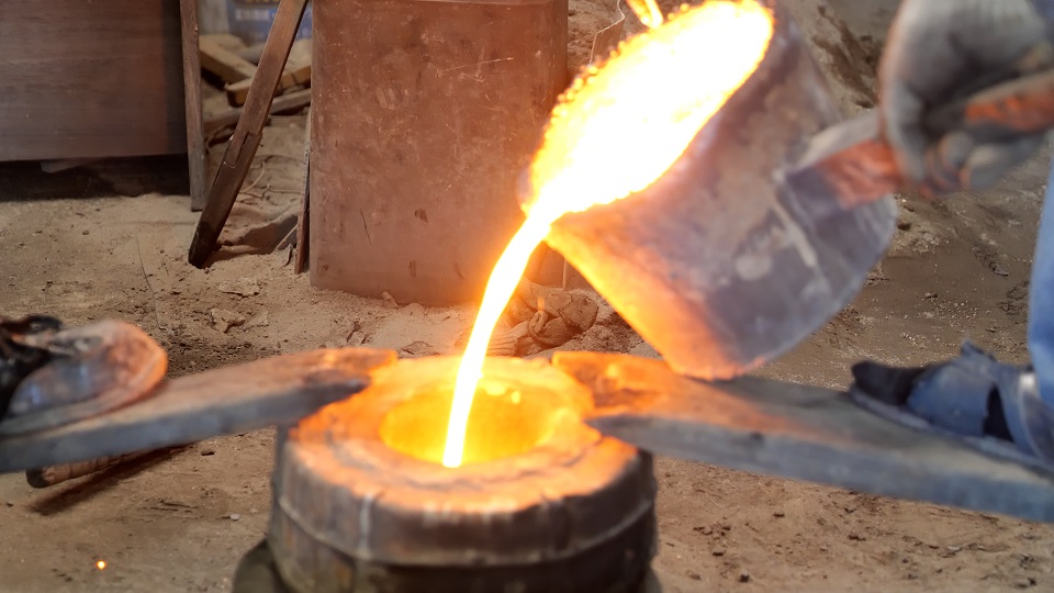 Pouring molten iron into a mold in a Nanbu ironware workshop in Iwate