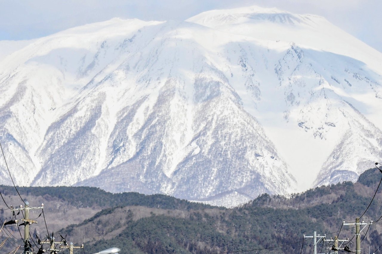 Mount Iwate rising over a town in Iwate, home of Nanbu ironware