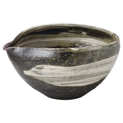 An iron-glaze stoneware katakuchi with a single thumb-pressed pouring lip, the spouted bowl that has aged best into contemporary Japanese tableware