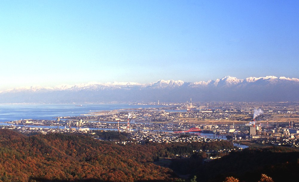 Takaoka and Toyama Bay with the snow-capped Tateyama mountains beyond
