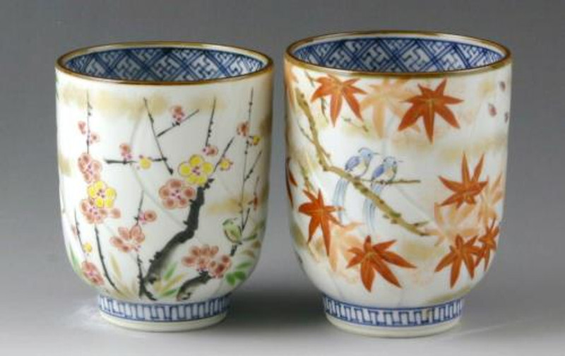 Kiyomizu-yaki teacups hand-painted with ume blossoms and momiji leaves, accented with soft gold