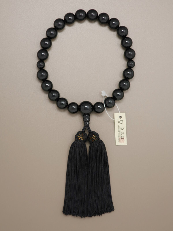 Black onyx juzu beads with polished surface