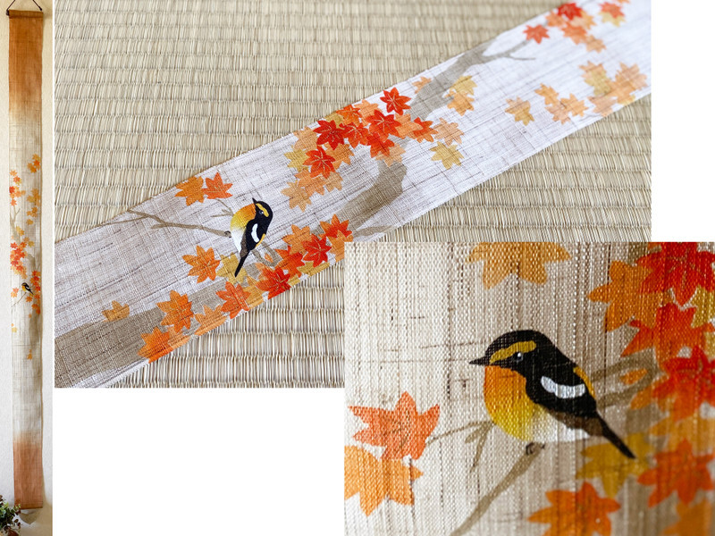 Kyoto hand-dyed linen tapestry featuring momiji leaves and a small bird, glowing softly in natural light